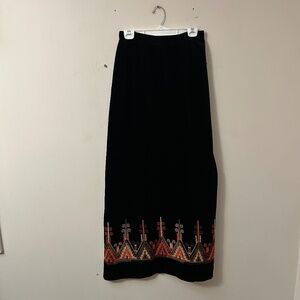 Vintage black velvet maxi skirt with hand stitching along the hem.